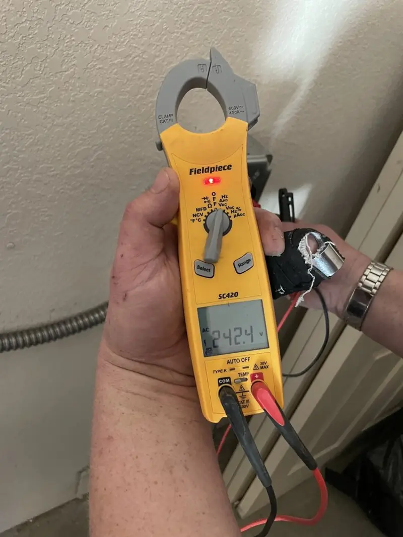 Voltage testing with clamp meter during Generator Installation in Crescent Springs